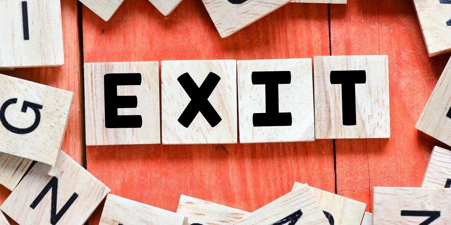 The word exit is spelled out in wooden blocks.